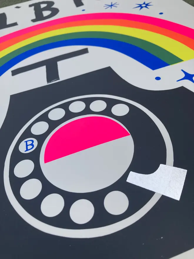 'Dial B For Blue Skies' Screenprint, a colourful screenprint outside that says 'Dial b for blue skies'. It depicts a telephone with a rainbow. 