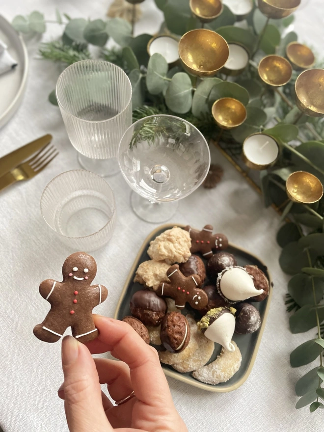 Hand-decorated gingerbread men biscuits in a luxury gift box, festive Christmas spiced cookies ideal for gifting
