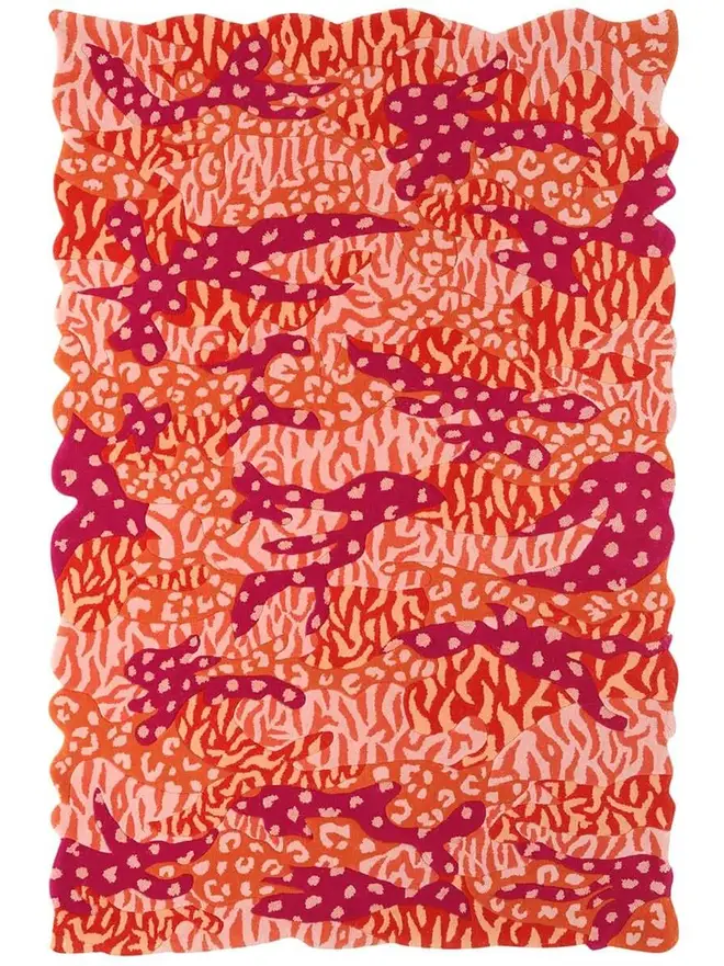 Big Cat Camo Hand Tufted Rug, a colourful rug sitting on a plain surface. 