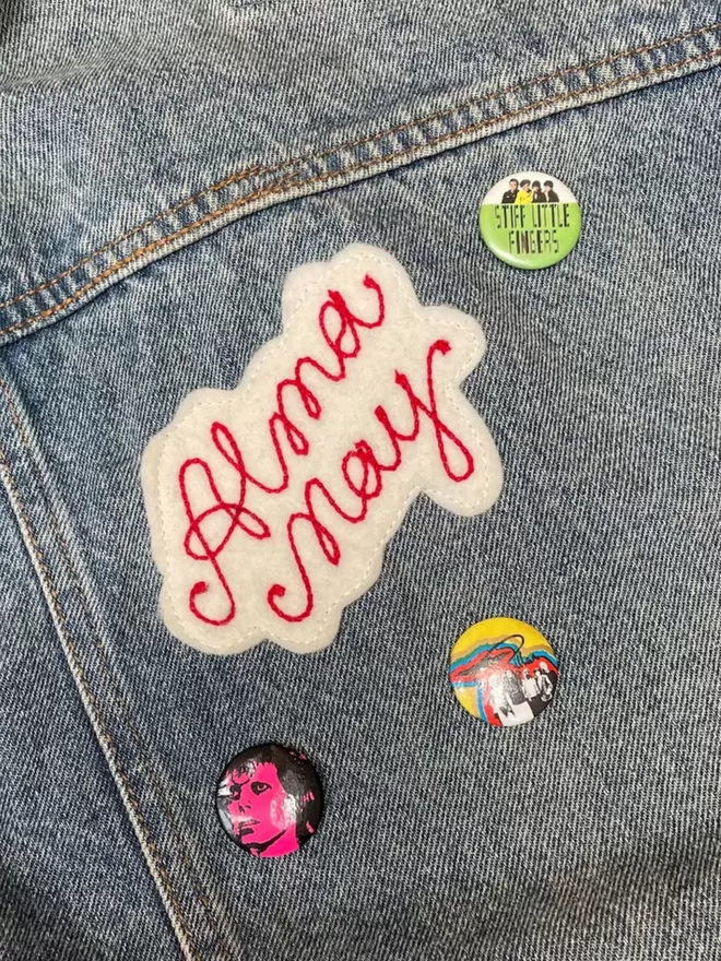 Personalised embroidered chain stitched patch on a jacket.