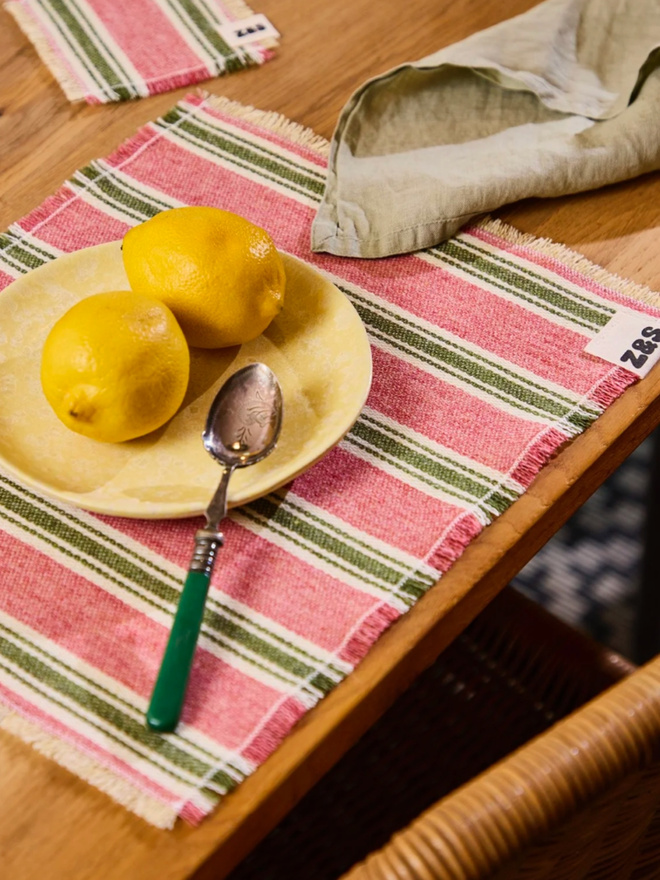Pink Sherbet Placemats. A pink sherbet placemat on a table.