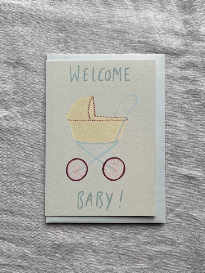 welcome baby card with a pram on the front