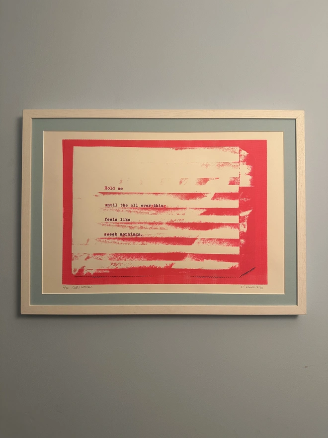 pink screenprint with blue mount in white frame