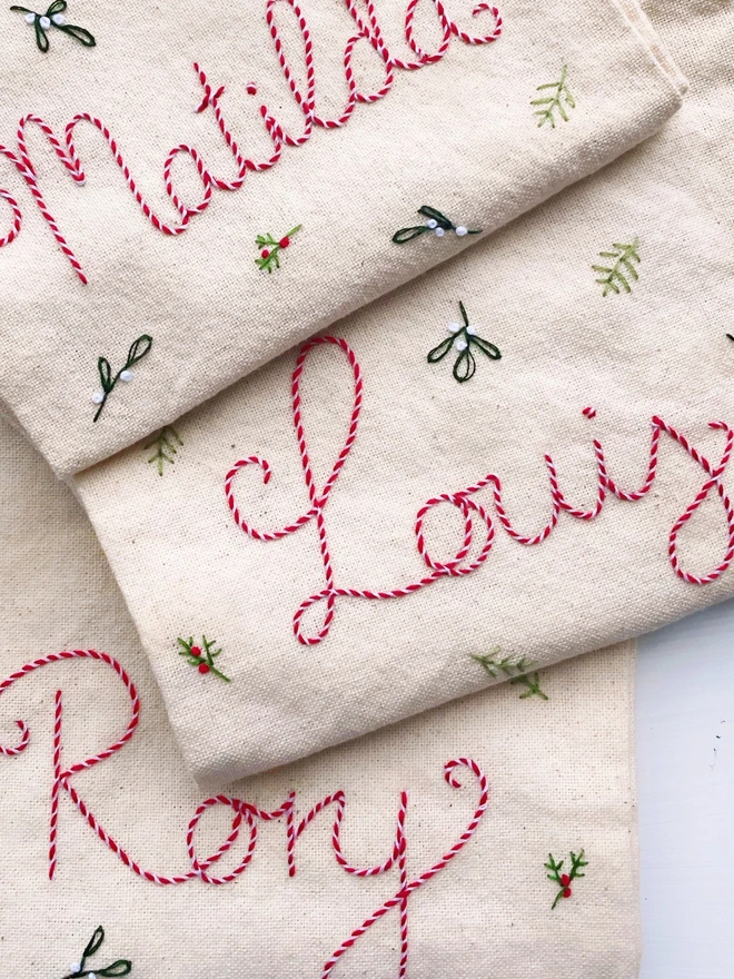 Christmas stockings with the names Matilda, Louis and Rory