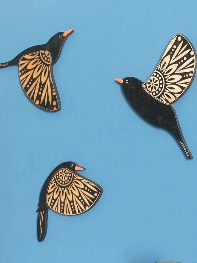 Folk Art Wooden Blackbirds (Set Of 3), group of blackbirds flying hanging on a wall. 