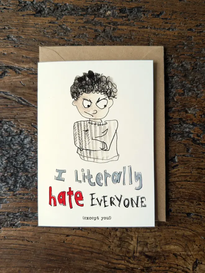 i hate everyone except you humorous and cheeky valentine or love card shown in flat lay.