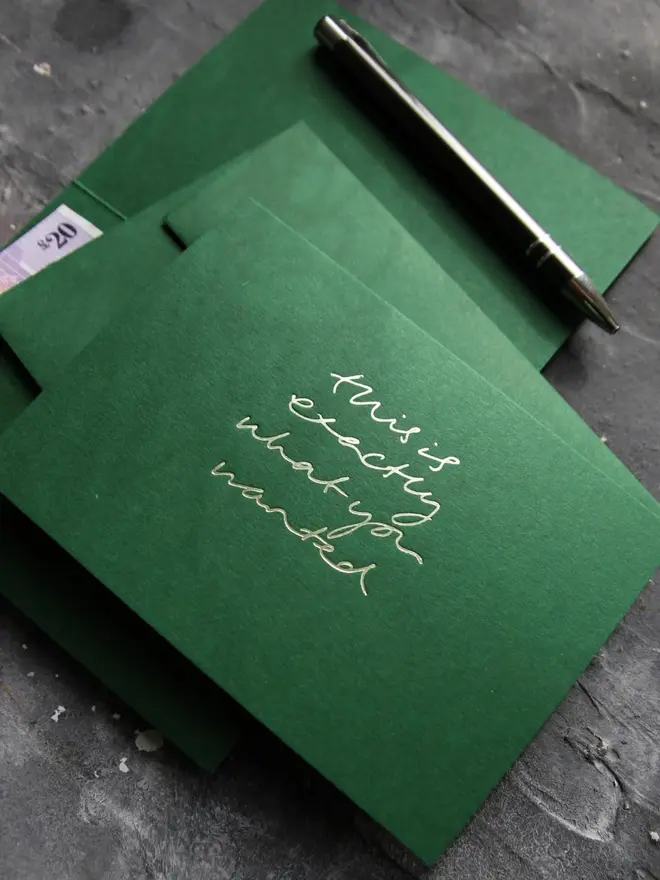 Hand foiled cash card or money wallet in a forest green colour handfoiled in shiny lime green text which says 'this is exactly what you wanted'.