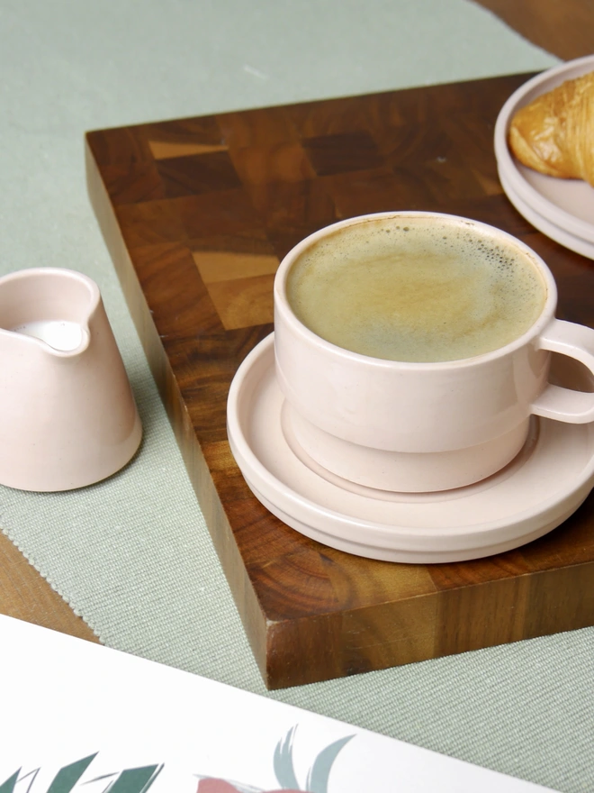 Ceramic Milk Jug next to a coffee cup