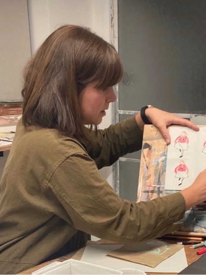 artist working at drawing board