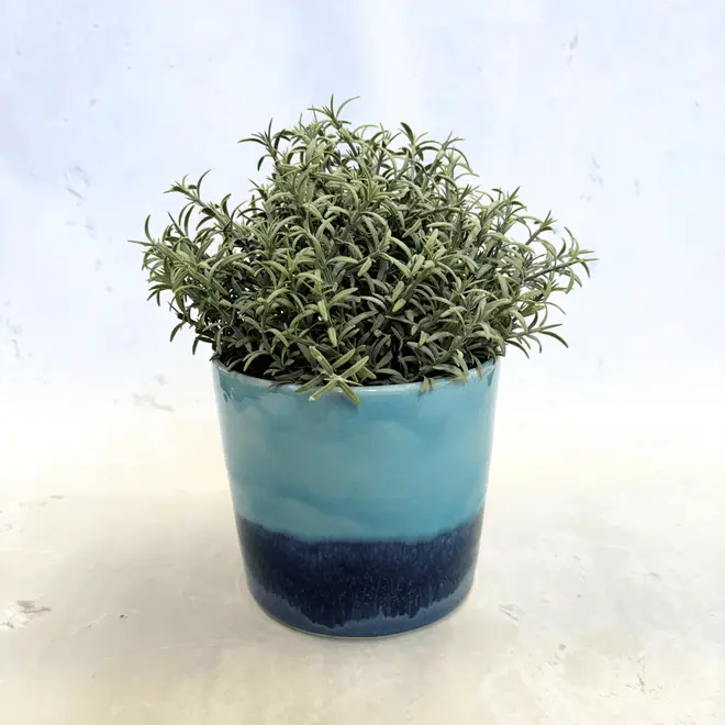 Landscape Medium Pot, a colourful pot on a stone surface. It is accompanied by a pot. 