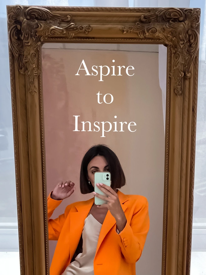 aspire to inspire mirror decal on a hallway mirror