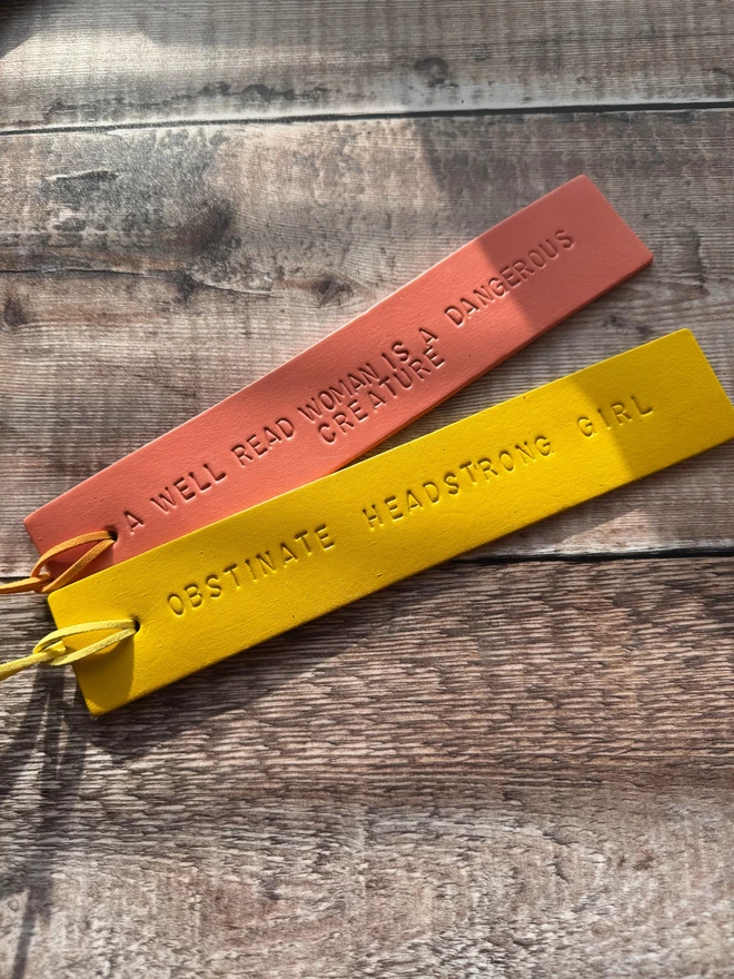 Colourful hand-painted leather bookmarks with embossed quotes, each featuring a leather tie. A stylish and durable accessory for book lovers, perfect as a personalised gift