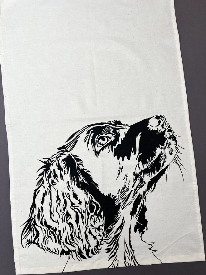 Full image of springer dog tea towel with the springers head printed in the bottom half