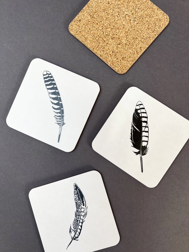 Three coasters with one showing the back.