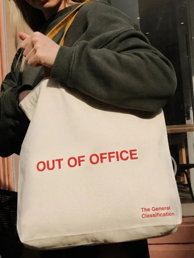 Out Of Office Tote Bag, worn by a woman. 