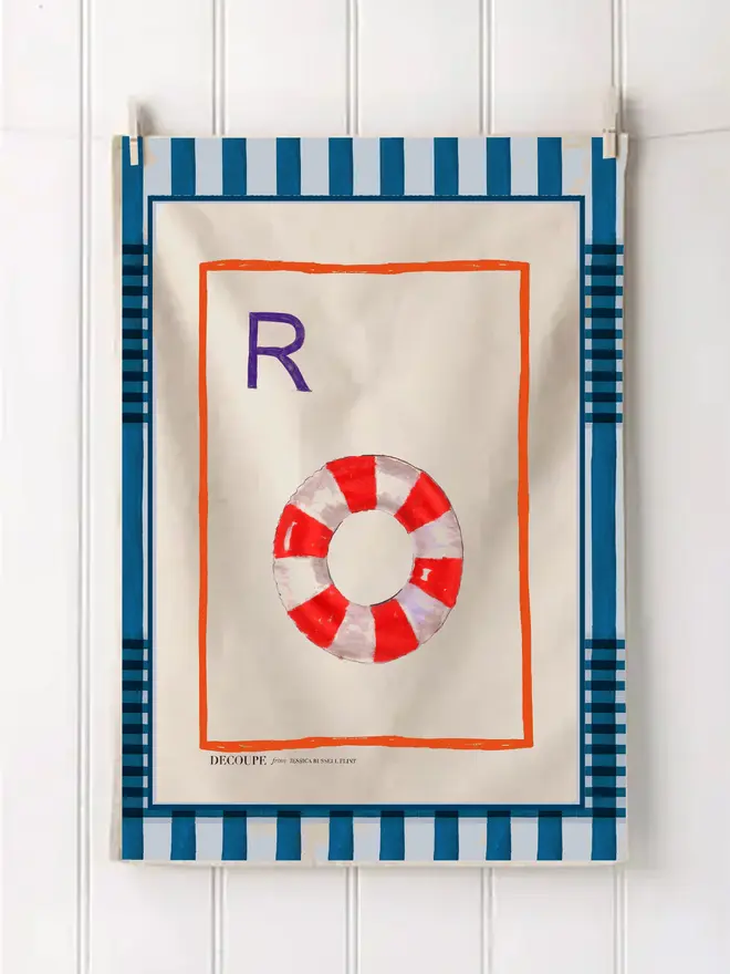 a-z alphabet tea towel. a tea towel with a rubber ring print and the letter 'e' in the corner.