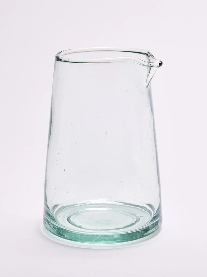 Tapered Carafe, glass carafe sitting on a white surface. 