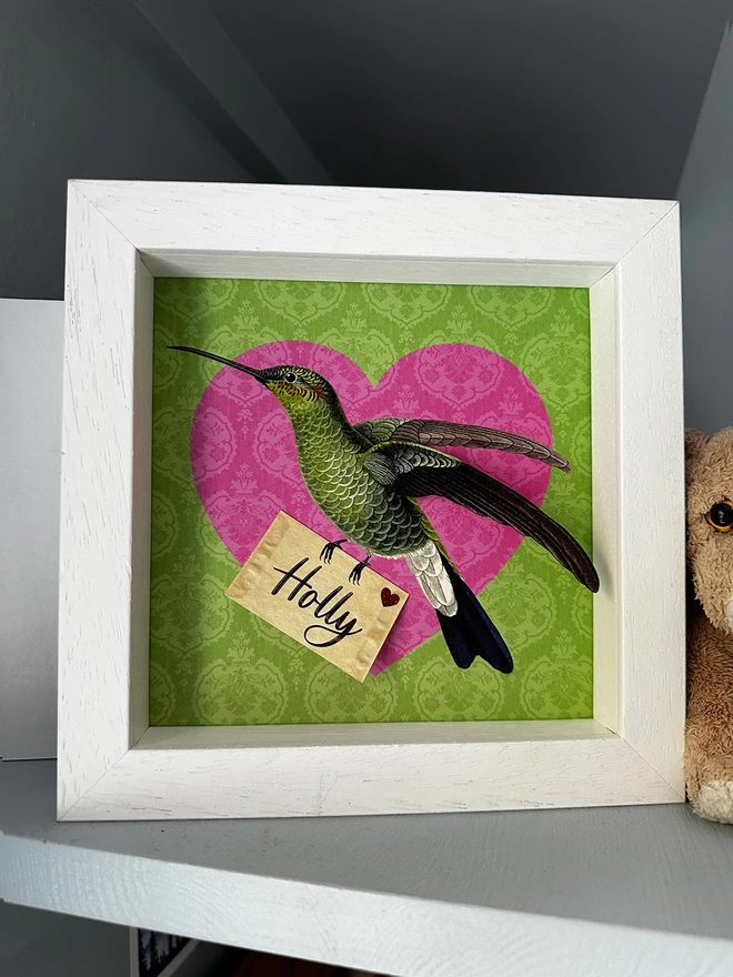 Personalised new baby hummingbird in frame, pink heart and green background