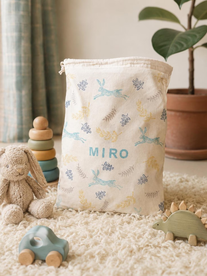 personalised toy sack. a drawstring bag with printed woodland creatures and a personalised name.