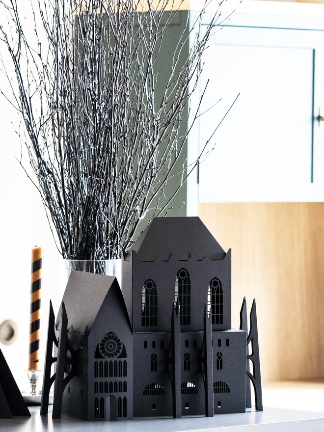 black halloween gothic house on the table