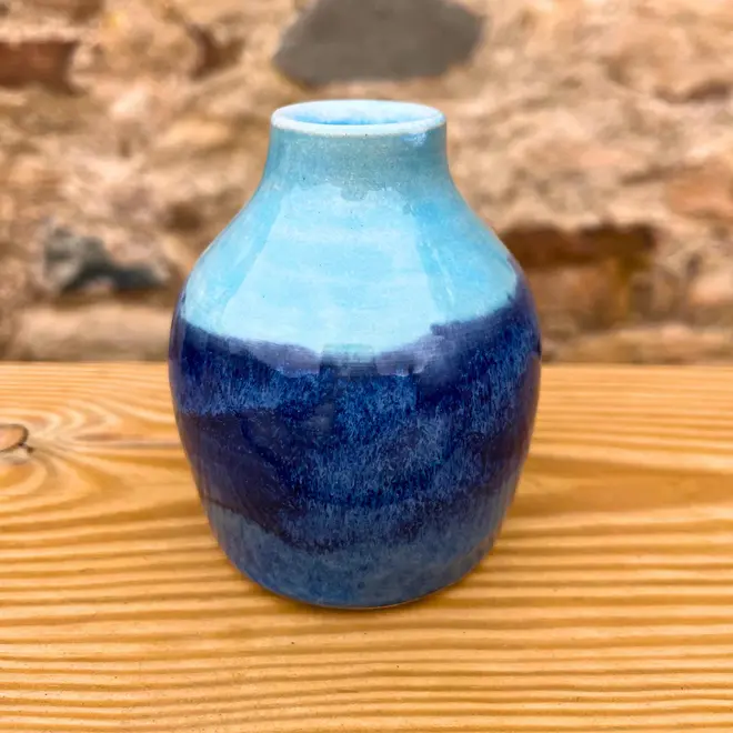 Landscape Bud Vase, a colourful vase sitting on a wooden surface. 