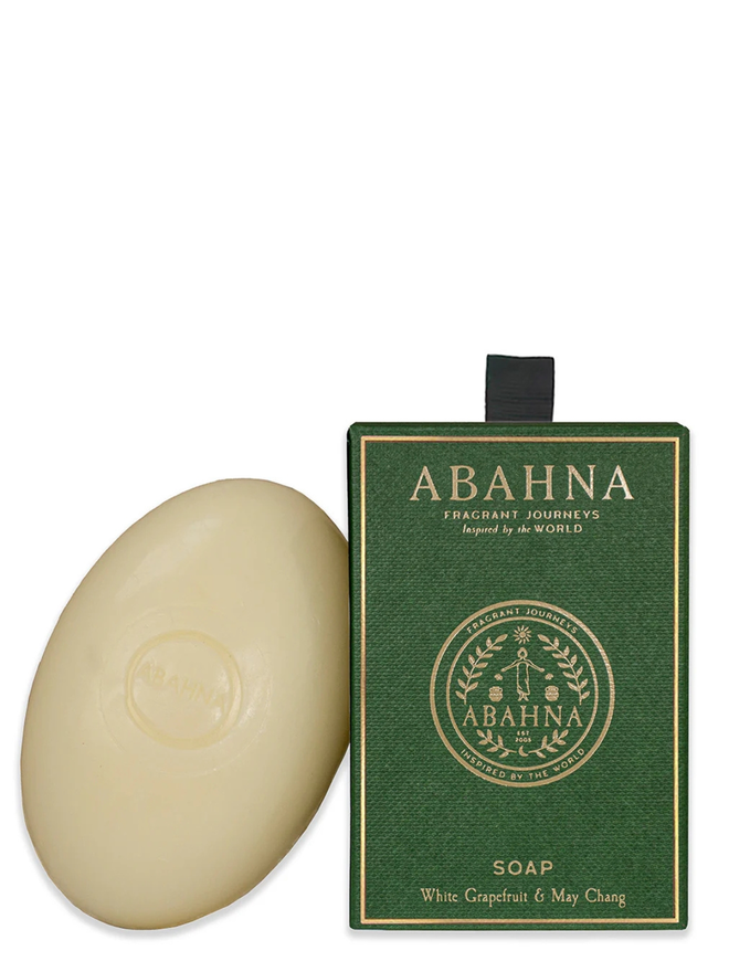 white grapefruit and may chang soap bar. a bar of natural soap leaning against a green gift box.