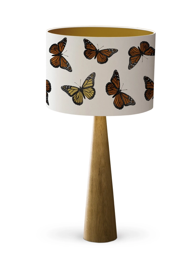 Mountain & Molehill monarch butterfly shade with gold detail on wood lamp base