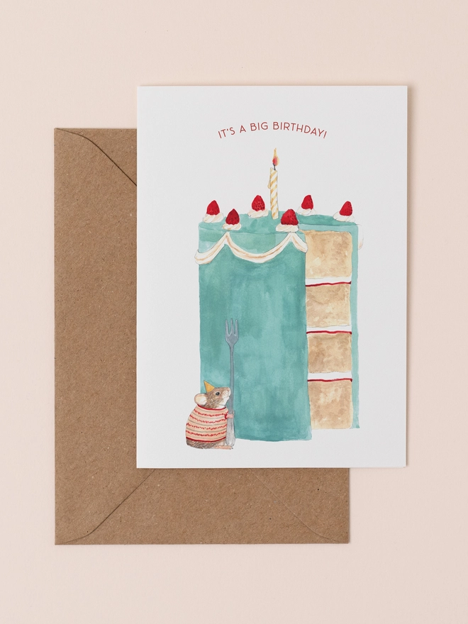Birthday card with an illustration of a mouse and a big cake, with a recycled kraft envelope