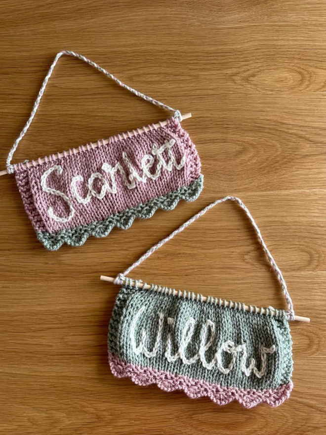 The Scallop Banner. A selection of scallop banners in pinks and greens, with white lettering.