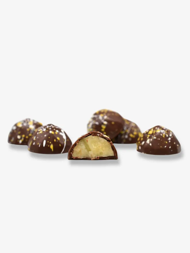 loose pina colada milk chocolates with one cut in half
