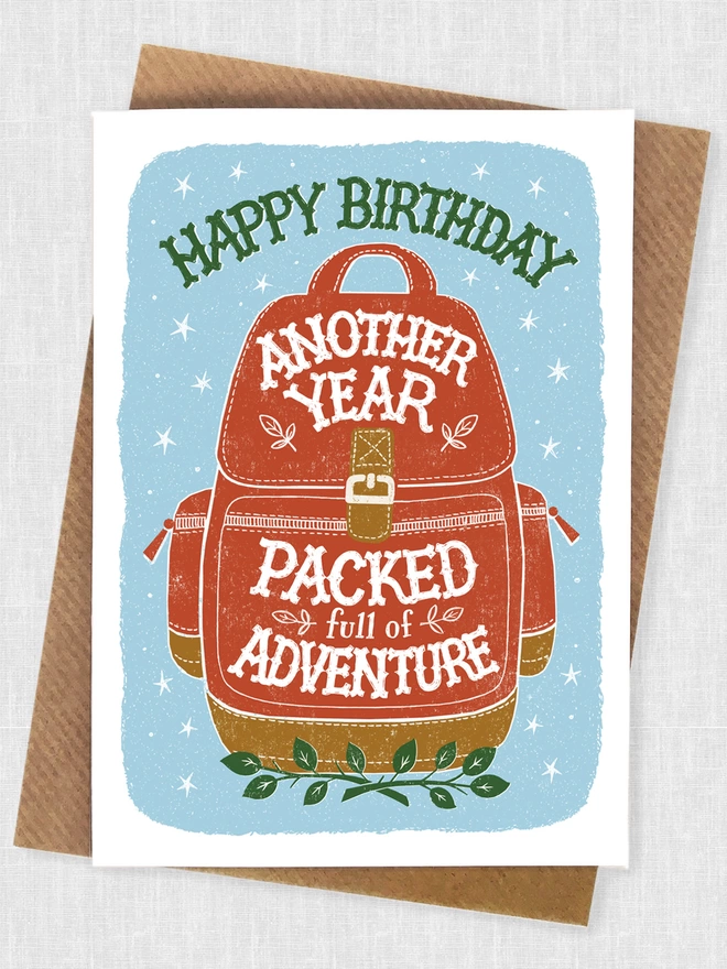 Red backpacking birthday card with blue background