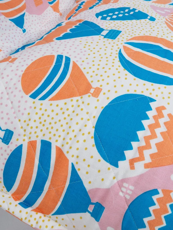 Detail of Balloons At Dawn Bean Bag Cover, a colourful bean bag with hot air balloon print.