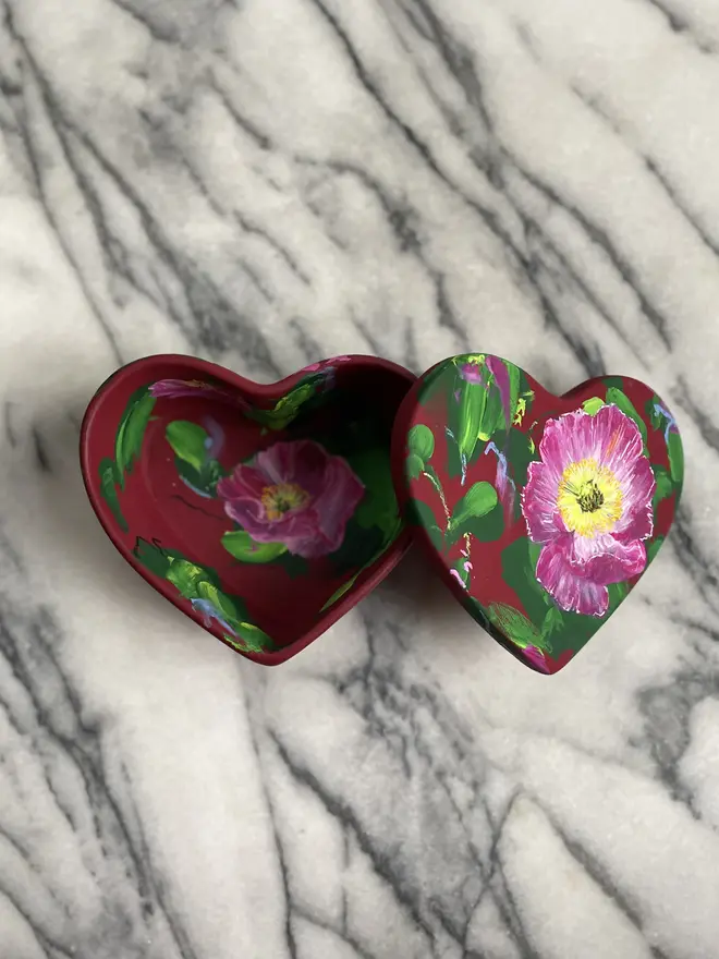 hand painted floral ceramic heart shaped keepsake box background in a deep red with pink Icelandic poppy flowers