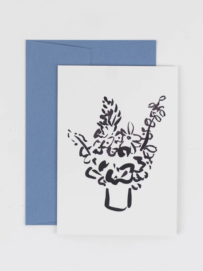 A greetings card featuring a loose illustration of a vase of flowers in thick black ink.