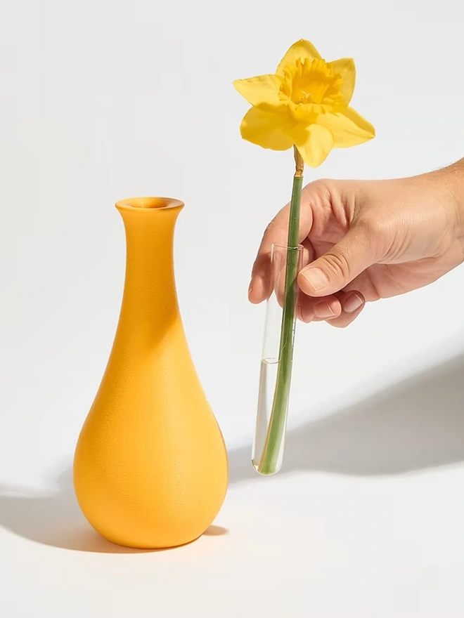 yellow 3d printed vase with yellow flower