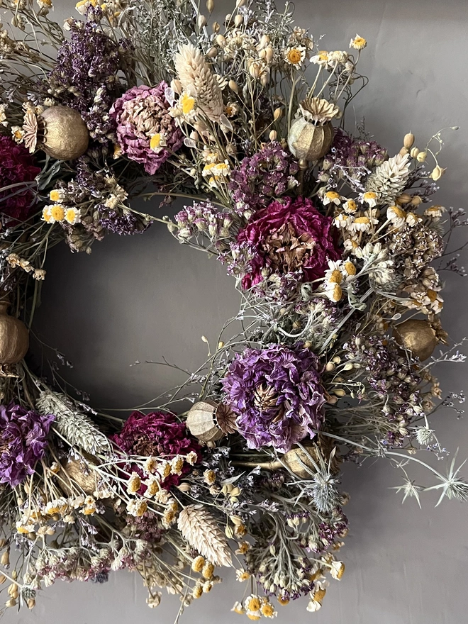 Autumnal dried flower wreath made with a range of seasonal flowers. 
