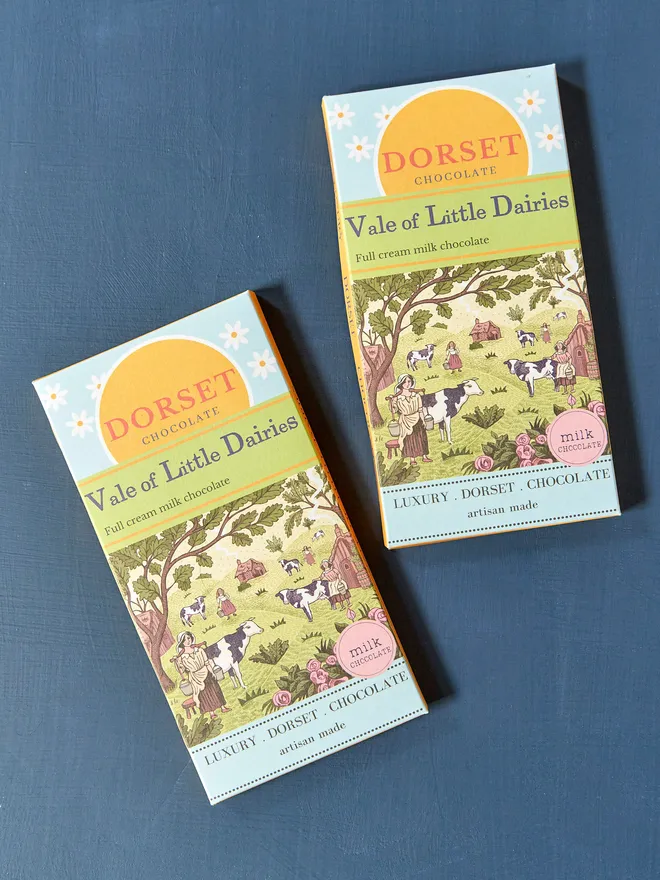 dorset chocolate milk chocolate bar with 'vale of little daisies' title and illustration of farm with various animals