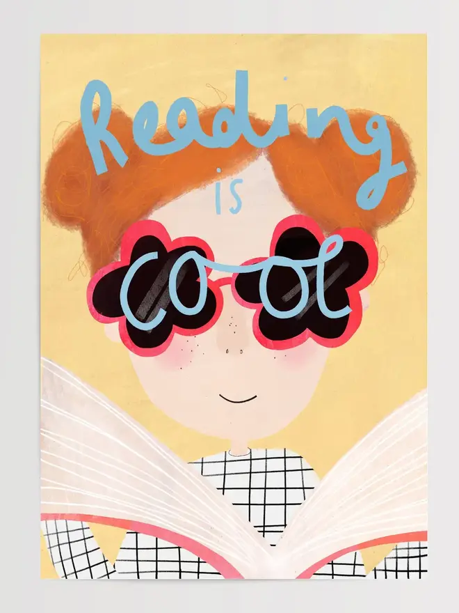 'reading is cool' illustrated a3 print. print featuring a young girl reading a book.