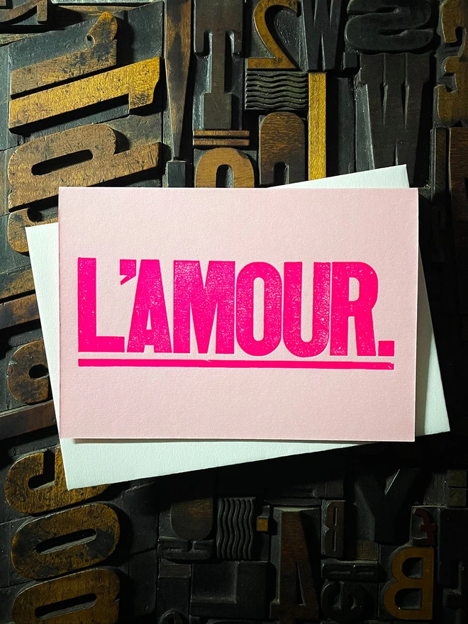 L’Amour! A beautiful wooden type letterpress card printed with rich fluorescent pink ink on thick Candy Pink card with a luxury matching envelope; ideal to send a to a friend or loved one.