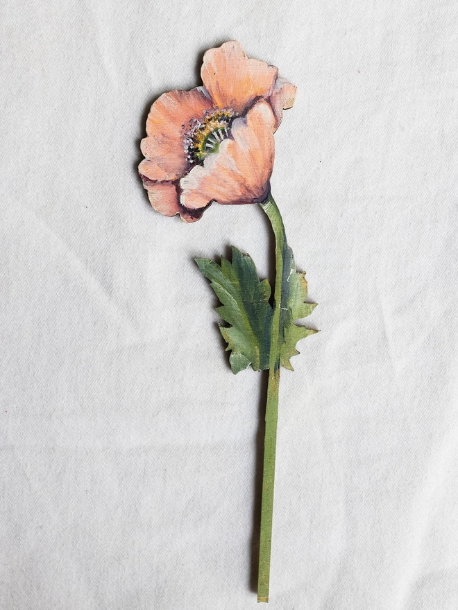 Wooden Poppy Stem, displayed on a white background