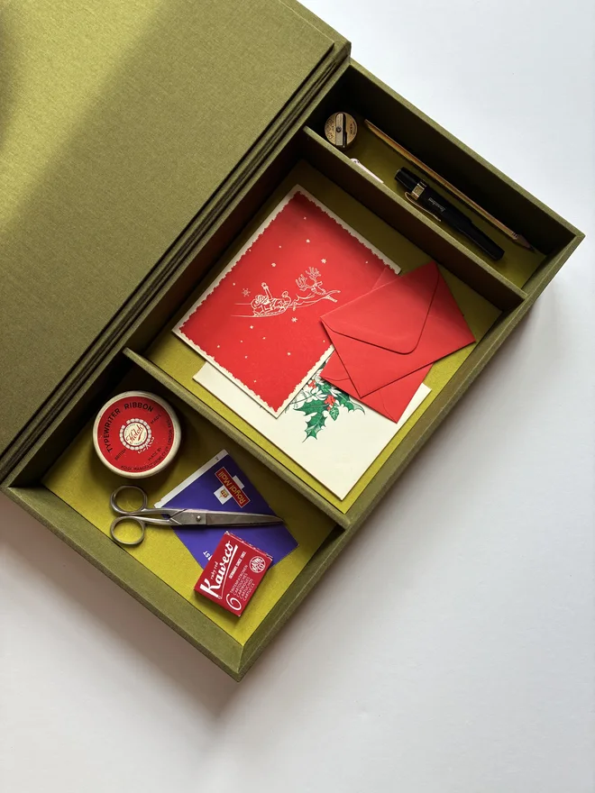 Open handmade Christmas Correspondence box in Olive green cloth displaying cards and stationery items