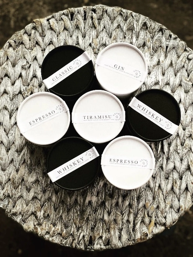 Chocolate Truffles, a stack of chocolate truffle tubs sitting in a pile. 