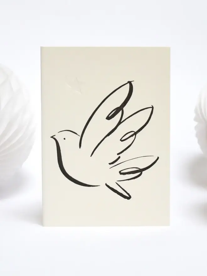 Letterpress Printed Peace Dove  Handcrafted. Black print on a white background. 