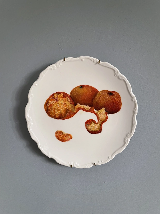 3 painted mandarins on plate