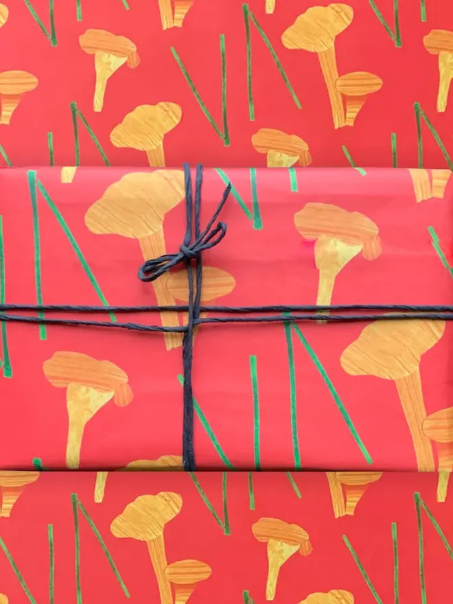 Chanterelle Mushroom Pattern Wrapping Paper, against a pattern background. 