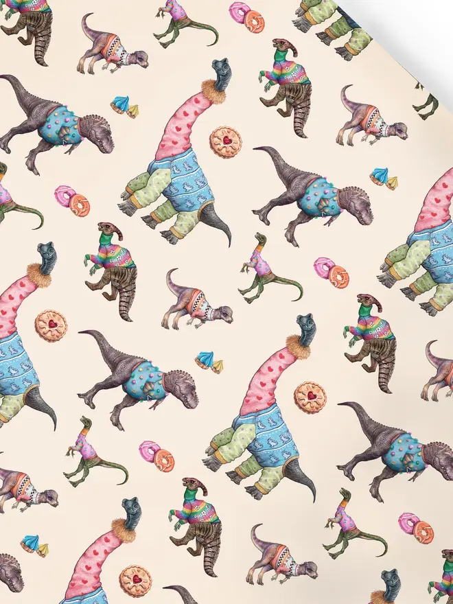 illustrated dinosaurs and biscuits wrapping paper sheets. a sheet of cream wrapping paper featuring illustrated dinosaurs and biscuits.