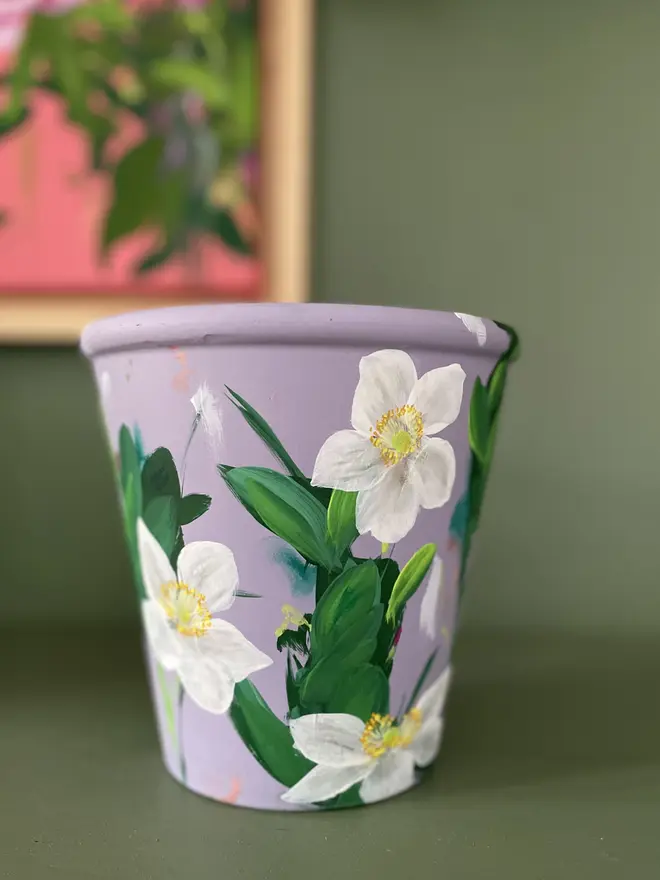 Hand painted floral plant pot lilc background with white anemone flowers