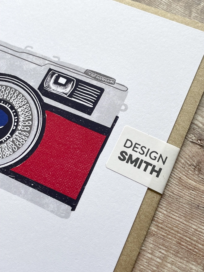 Close up of a Greetings card featuring a vintage camera illustration.