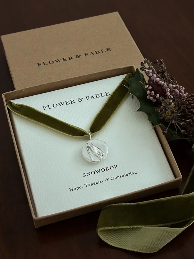 Sterling Silver Snowdrop Coin Charm with winter packaging