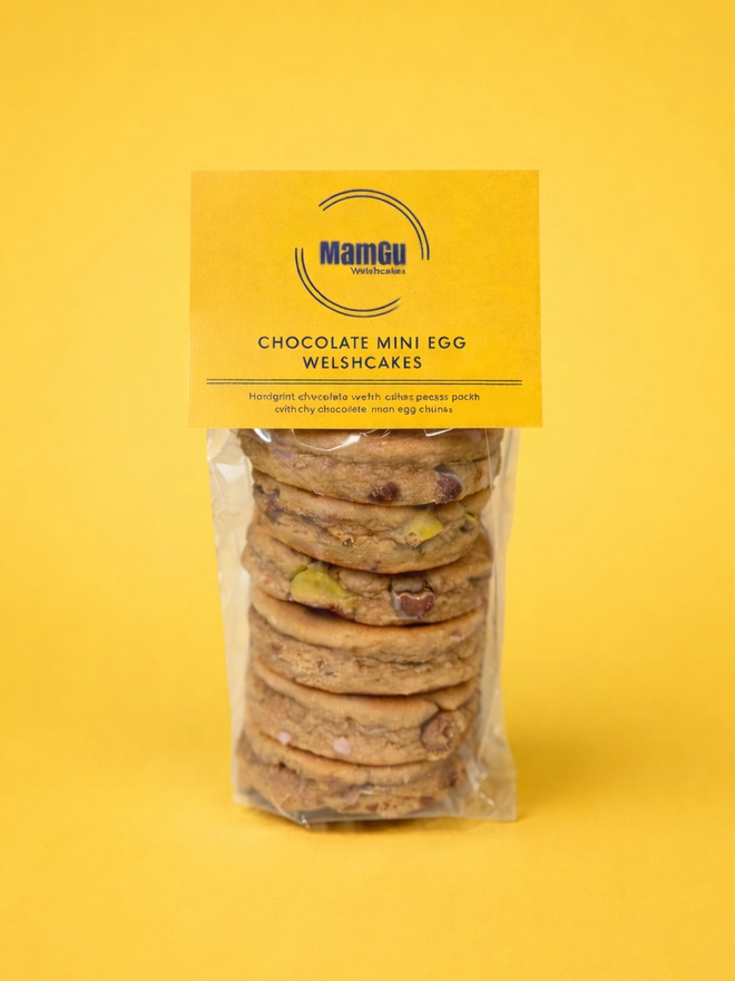 6 Mini Egg Welsh Cakes with a yellow MamGu Label and yellow background